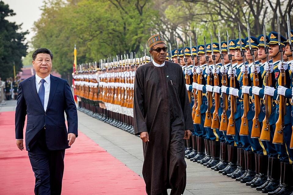 President Buhari and XI Jinping inspecting a guard of honour in China