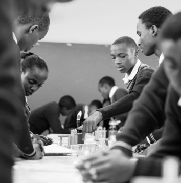 Students in Chemistry class at Karuri High School in Kiambu, Kenya on 30 May 2017. With Chemistry teacher Mr John Kaguru Ngigi. Teachers are using digital technologies such as laptops, projectors, videos, and internet access. The dynamic learning experience is part of the GESCI African Digital Schools Initiative supported by The MasterCard Foundation. The goal is to promote 21st century skills in schools in Kenya and to increase student engagement and improve test scores using digital technologies.